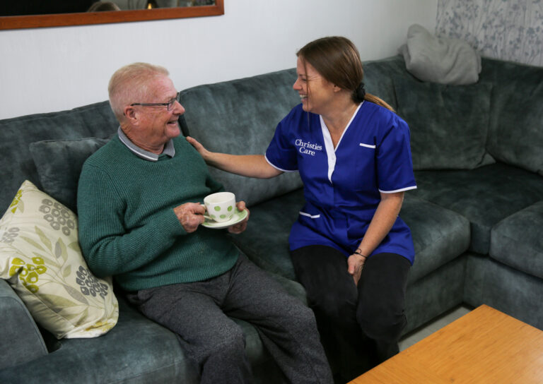 Christies Care Hourly Visiting care Client laughs with his carer