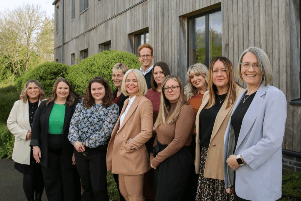 Christies Care Senior Leadership Team standind outside Christies Care, Runnel House building in Saxmundham