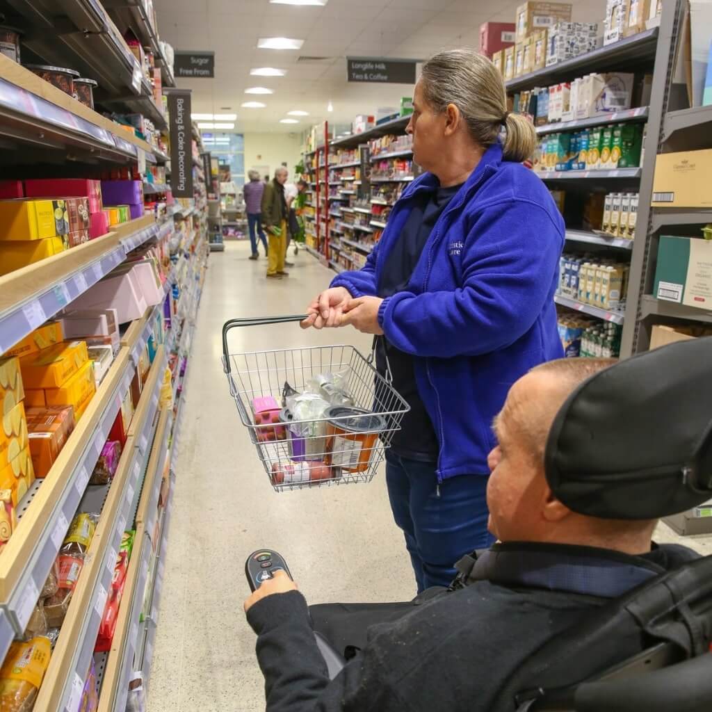Christies Care Client and Carer Shopping in Tesco